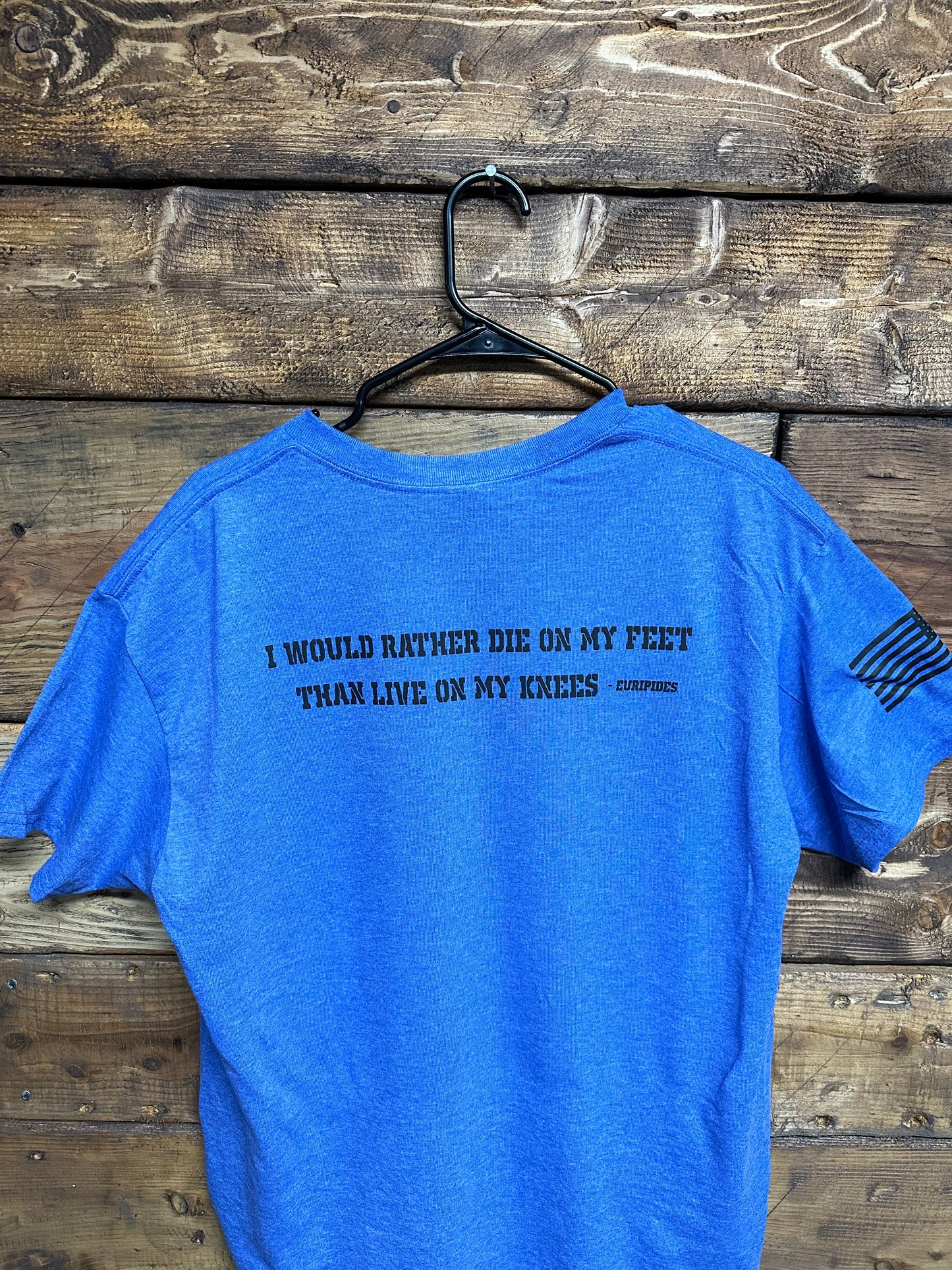 NE Blue T-Shirt with quote “I would rather die on my feet than live on my knees”